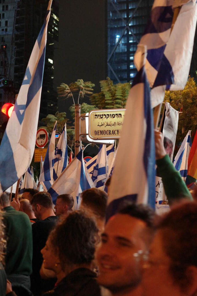 A street sign reads Democracy.